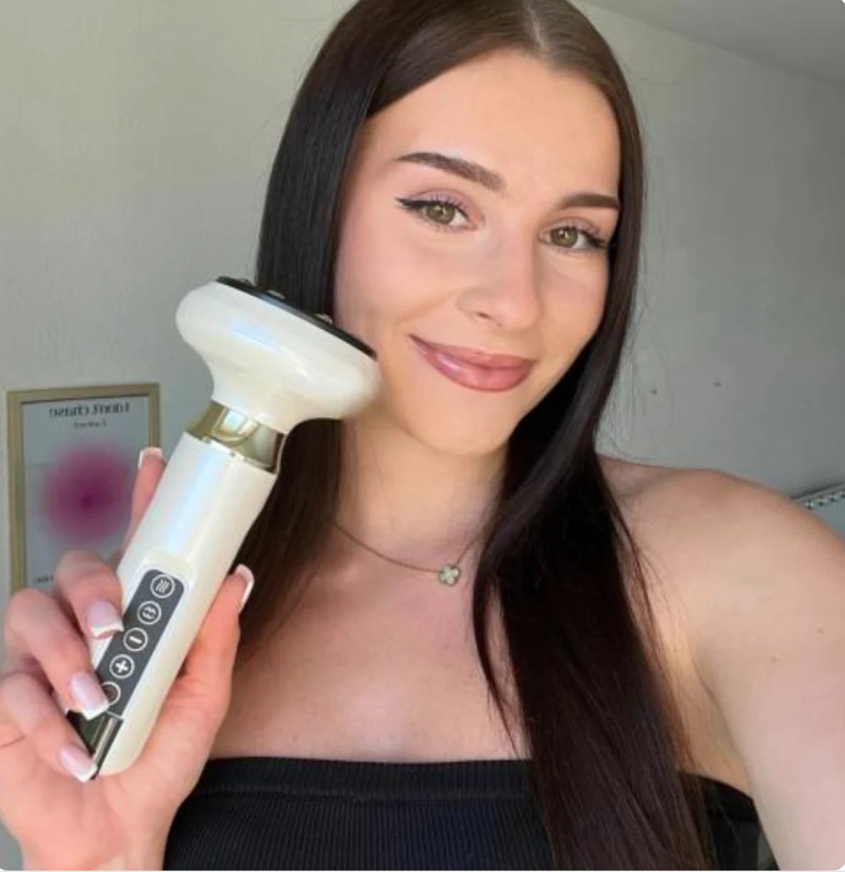Woman holding the Ineffable Sculpt Massager during her morning self-care routine